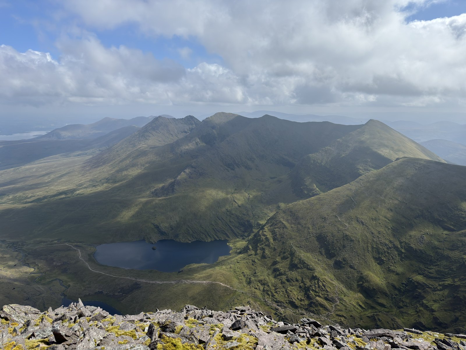 High panoramic view across the MacGillycuddy’s Reeks and mountain lakes