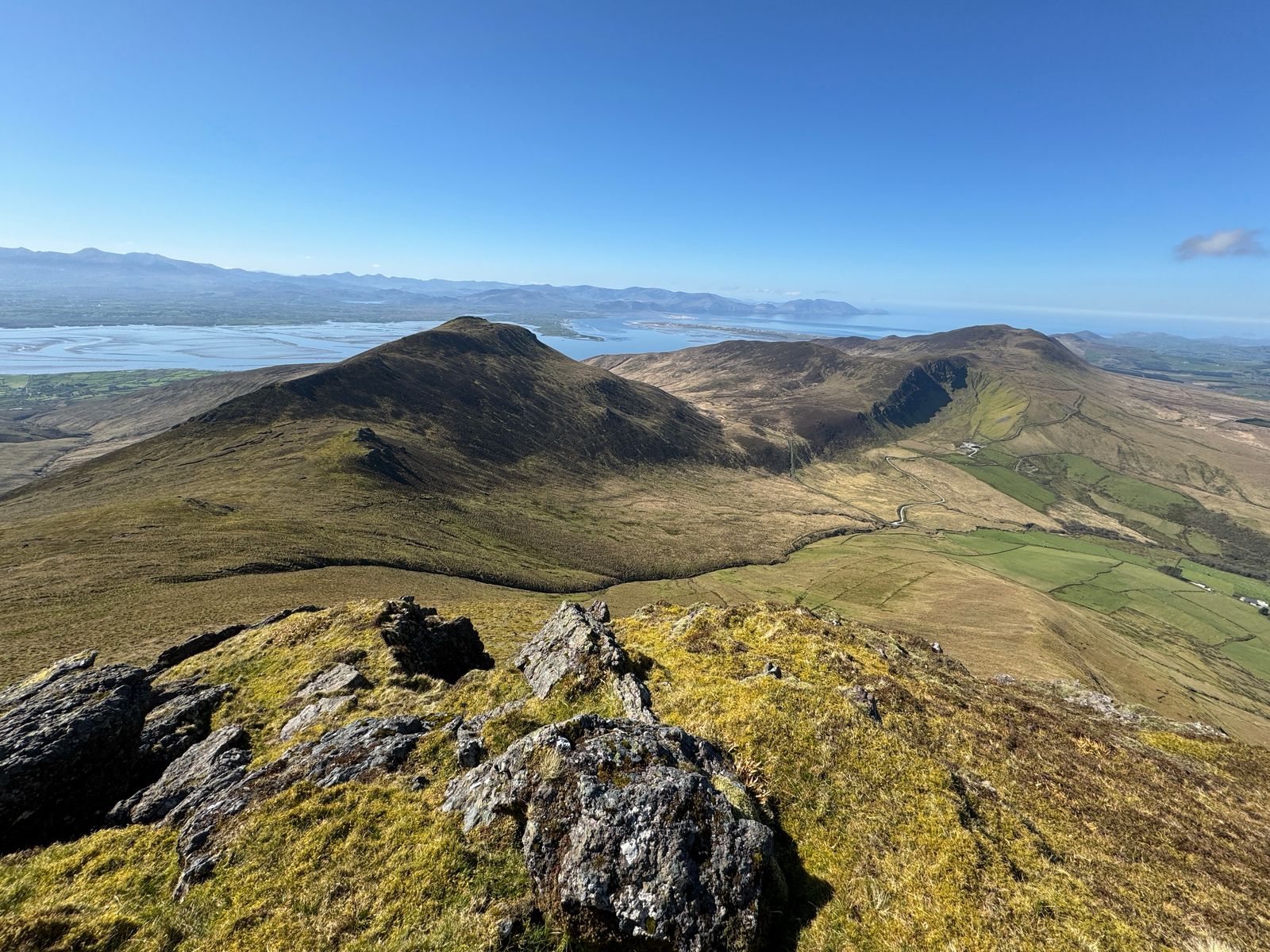 The descending ridge above Doire Mhór with the harbour and coast beyond