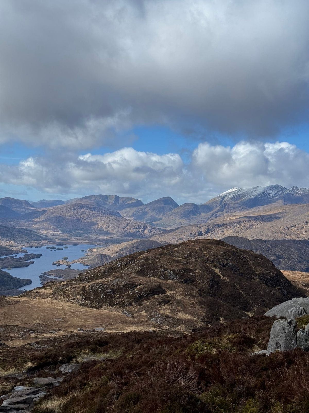 Wide panorama across the Killarney lakes and surrounding mountain landscape